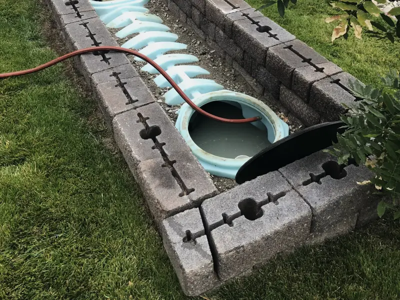 An open pump chamber in a raised block enclosure